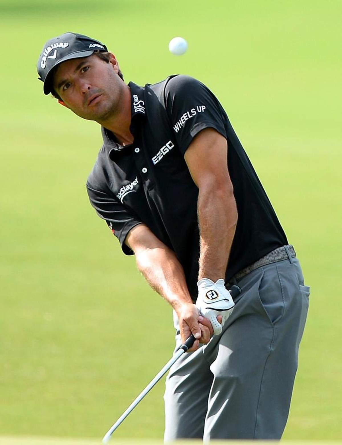 Kevin Kisner chips onto the 14th green during second round of the PGA Championship at Quail Hollow Club on Friday.