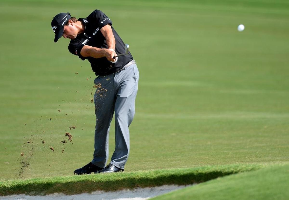 Kevin Kisner hits his second shot from the 16th fairway during second round of the PGA Championship at Quail Hollow Club on Friday. He finished the round with a 4-under 67.