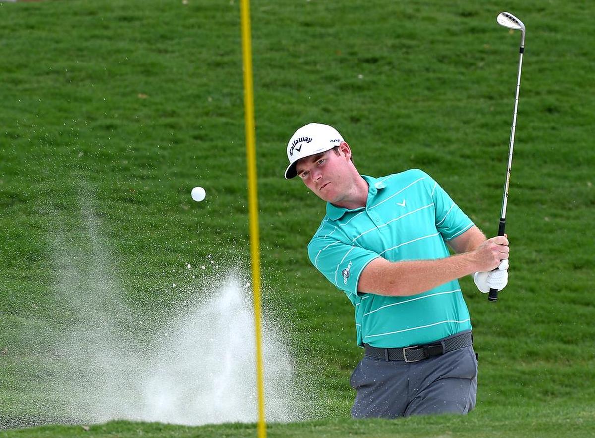 Grayson Murray hits out of a sand trap at the 18th green during first round action of the PGA Championship at Quail Hollow Club in Charlotte, NC on Thursday, August 10, 2017.