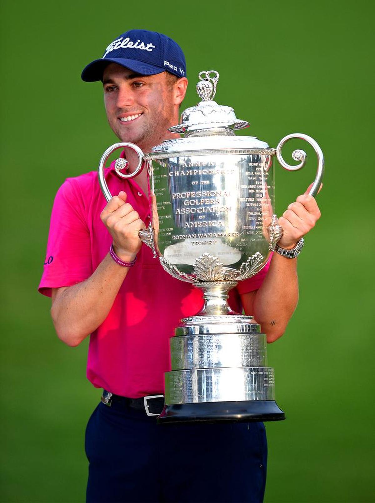 Justin Thomas poses with the Wanamaker Trophy following his victory in the PGA Championship at Quail Hollow Club in Charlotte, NC on Sunday, August 13, 2017.