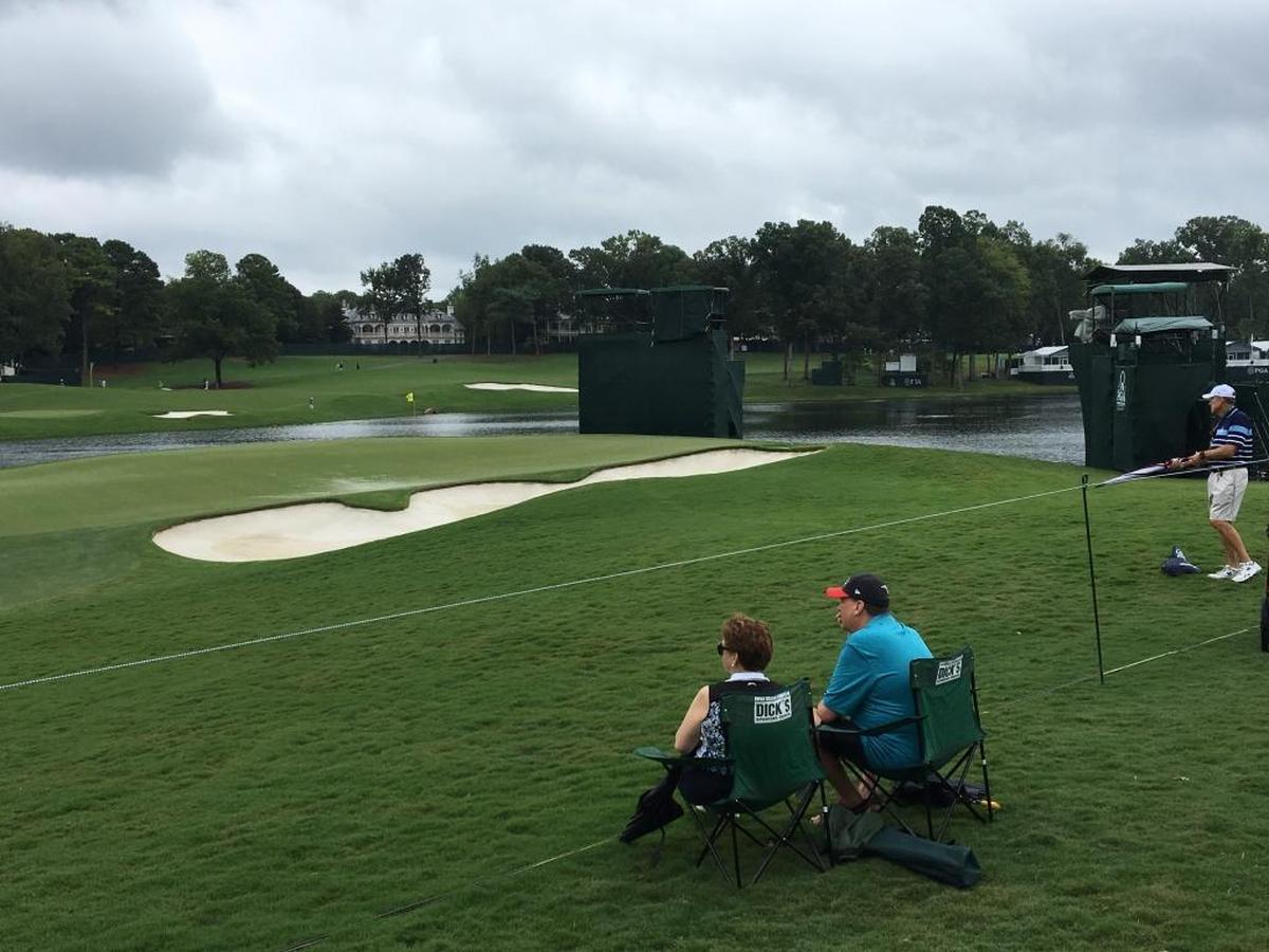 Fans take in the 16th hole at Quail Hollow, part of the famed Green Mile.