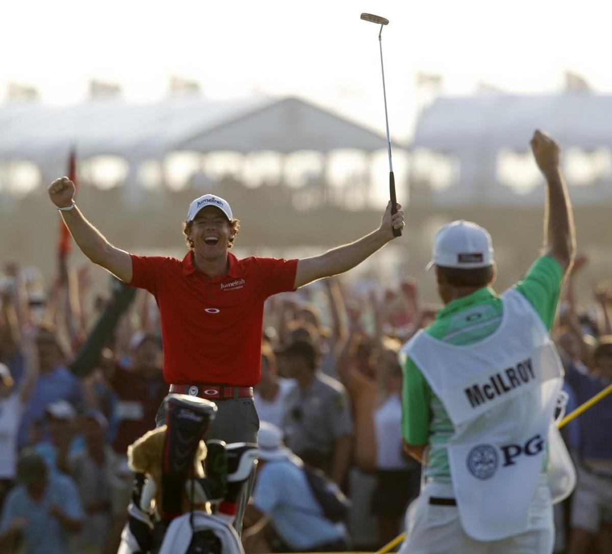 Rory McIlroy (in red) celebrates his 2012 PGA Championship victory on the Ocean Course of the Kiawah Island Golf Resort in Kiawah Island, S.C.