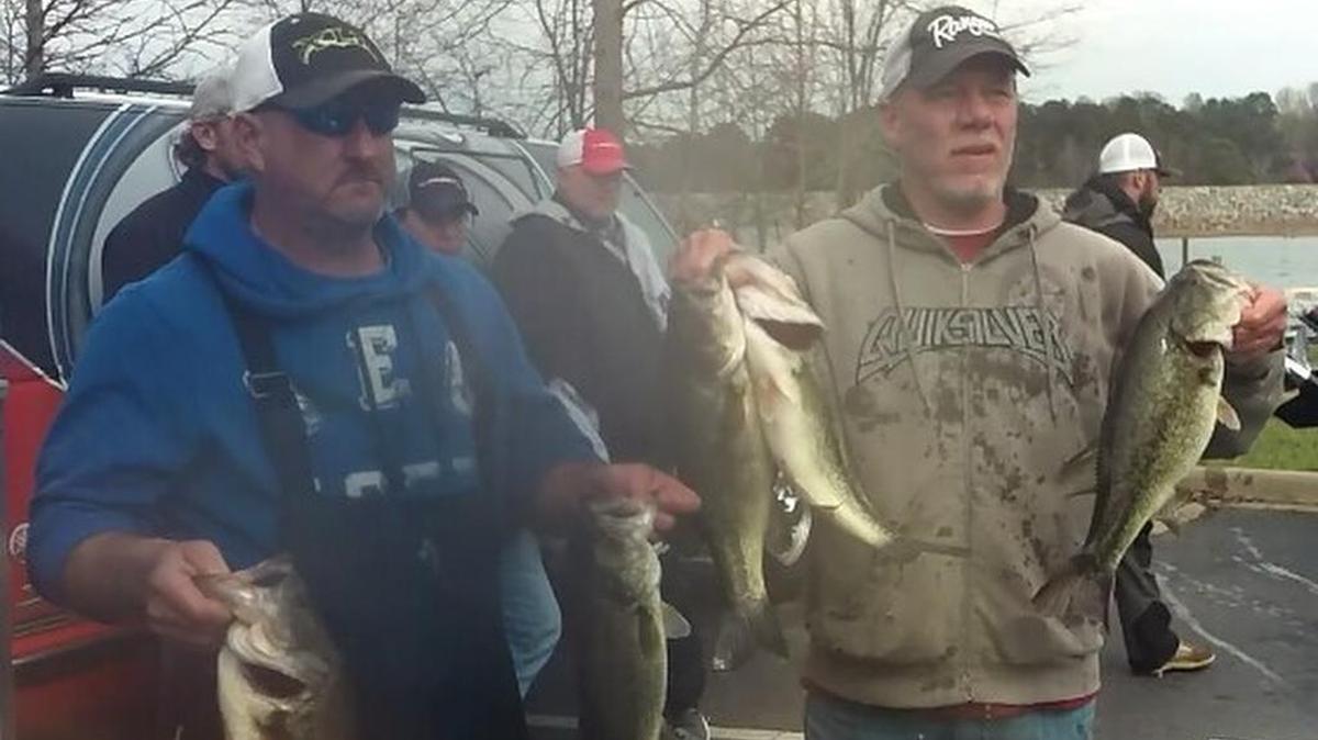 Dale Duncan and Donnie Woody of Marion show off their winning bass. They won the Carolina Bass Challenge with a total of 19.51 pounds and took home a $14,000 check.