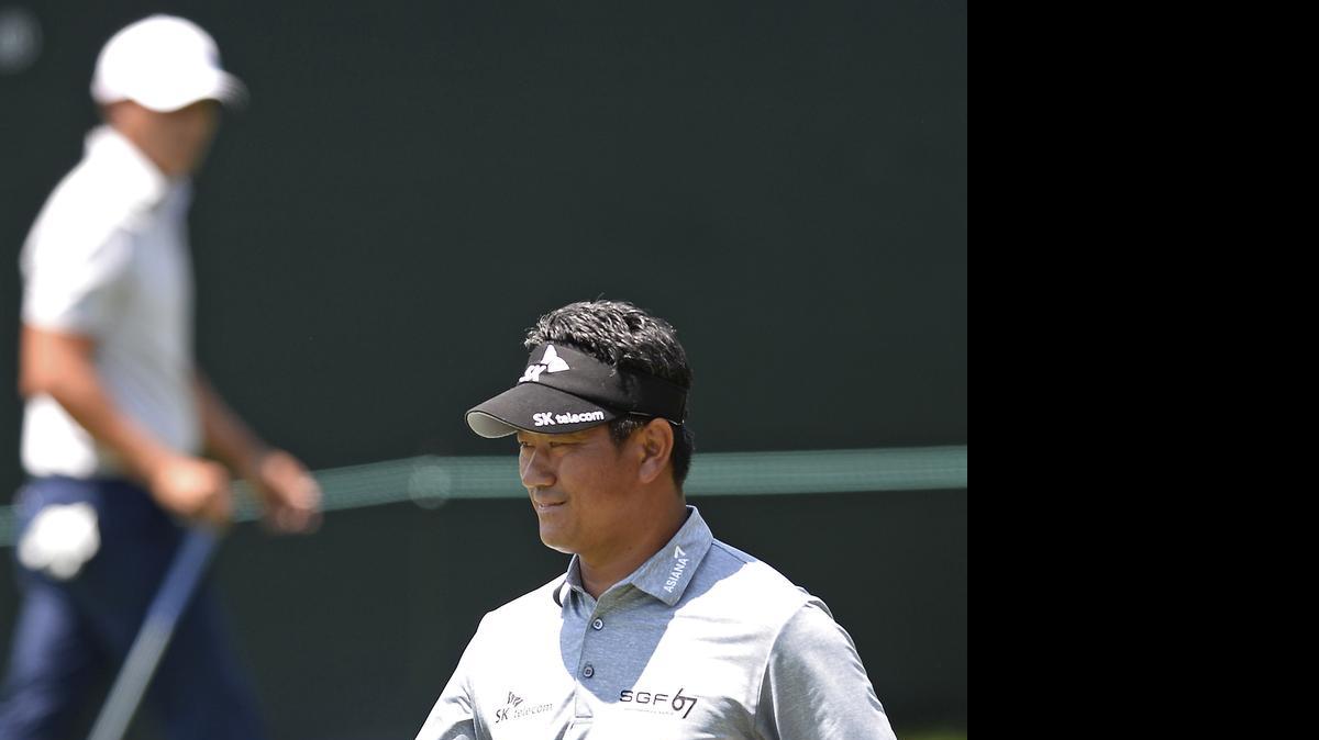 
K.J. Choi prepares to putt on the 15th green during first round action of the Wells Fargo Championship at Quail Hollow Club in Charlotte, Thursday, May 14, 2015. Choi finished his round at -4.
