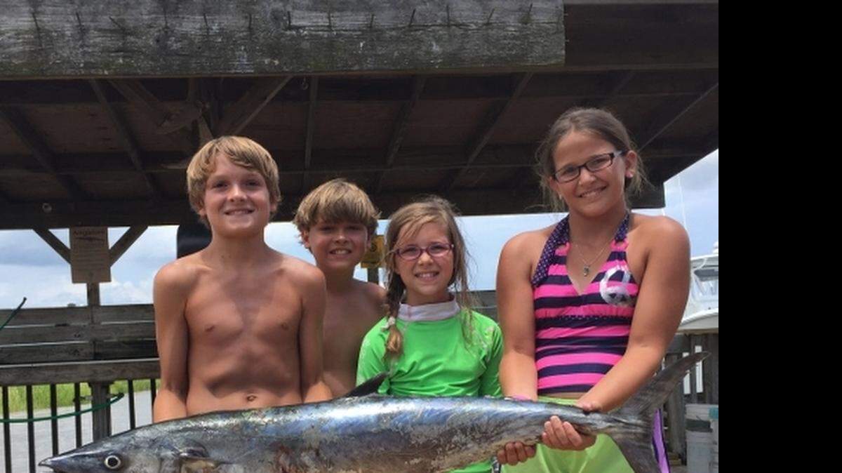 
Ford McClary, left, of Rock Hill proudly holds his first king mackerel, a 25-pounder caught this week off Georgetown, S.C. Lending an assist, left to right, are Charles McClary of Rock Hill and Spartanburg’s Lauren and Anna McClary. Their party was trolling from the Landing Lady.
