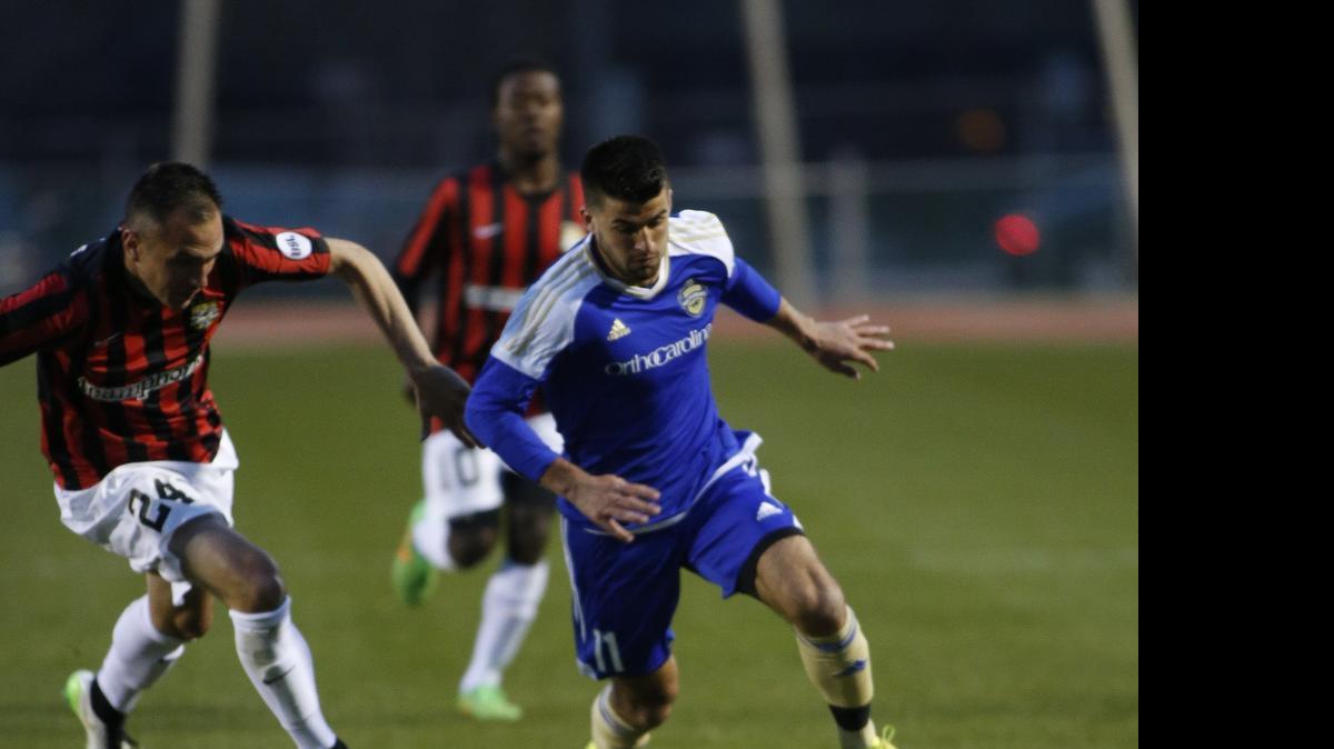 
Charlotte Independence midfielder Jack Thompson (right) beats Charleston Battery midfielder Zach Prince to the ball in the first half of United Soccer League game played at the Charlotte 49ers’ Transamerica Field. The team has also played at Winthrop University in Rock Hill this season. 
