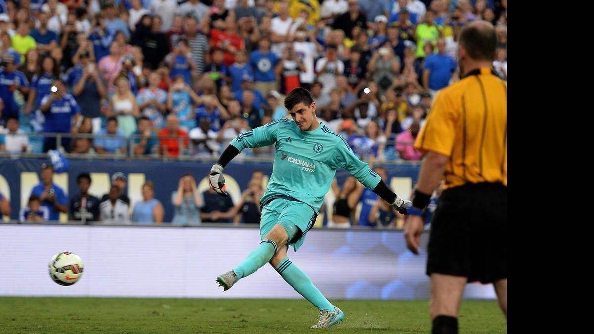 
Chelsea goalkeeper Thibaut Courtois kicks the winning goal on a penalty kick against Paris Saint-Germain during the International Champions Cup soccer match at Bank of America Stadium in Charlotte on Saturday, July 25, 2015. Chelsea defeated Paris Saint-Germain on penalty kicks. 

