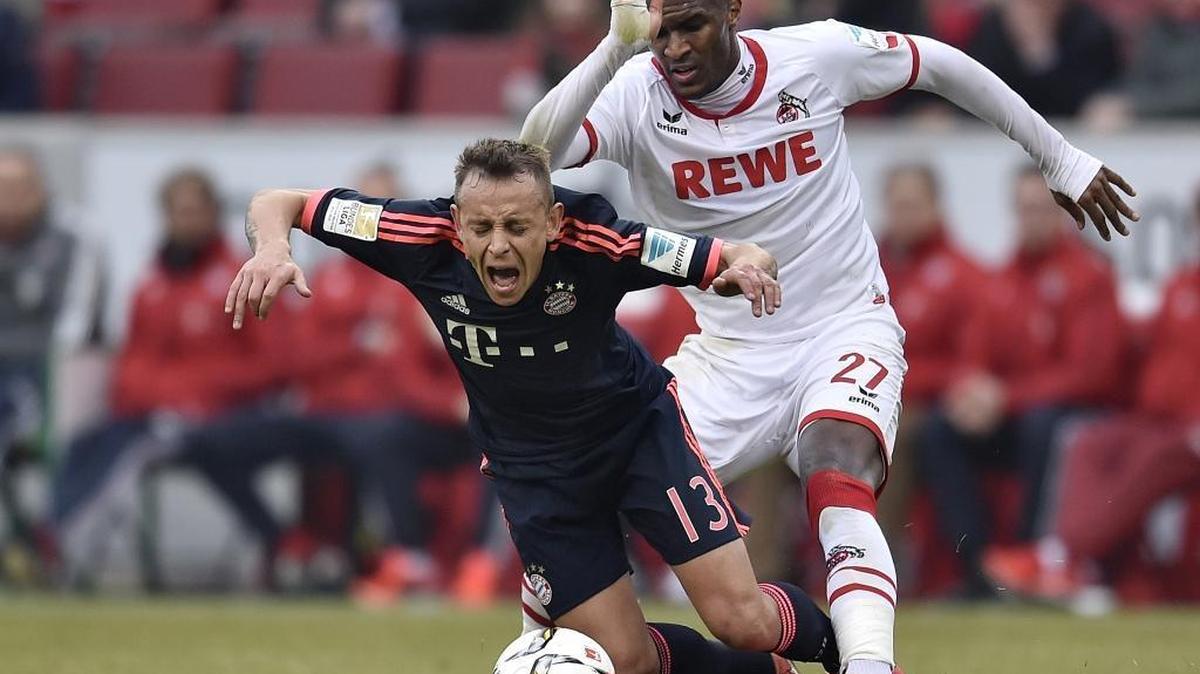 Bayern's Rafinha is fouled by Cologne's Anthony Modeste during the German Bundesliga soccer match between 1. FC Cologne and Bayern Munich in Cologne, Germany, Saturday.