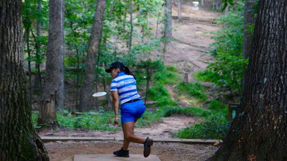 Alexis Mandujano from Universal City, Texas, tees off on the 5th hole during the semifinal round at Reedy Creek Park on Saturday, July 28, 2018. The target she is aiming for is white seen at the top right of the photo. Mandujano was the winner of the open women’s division at the Amateur World Championship held in the Charlotte area.
