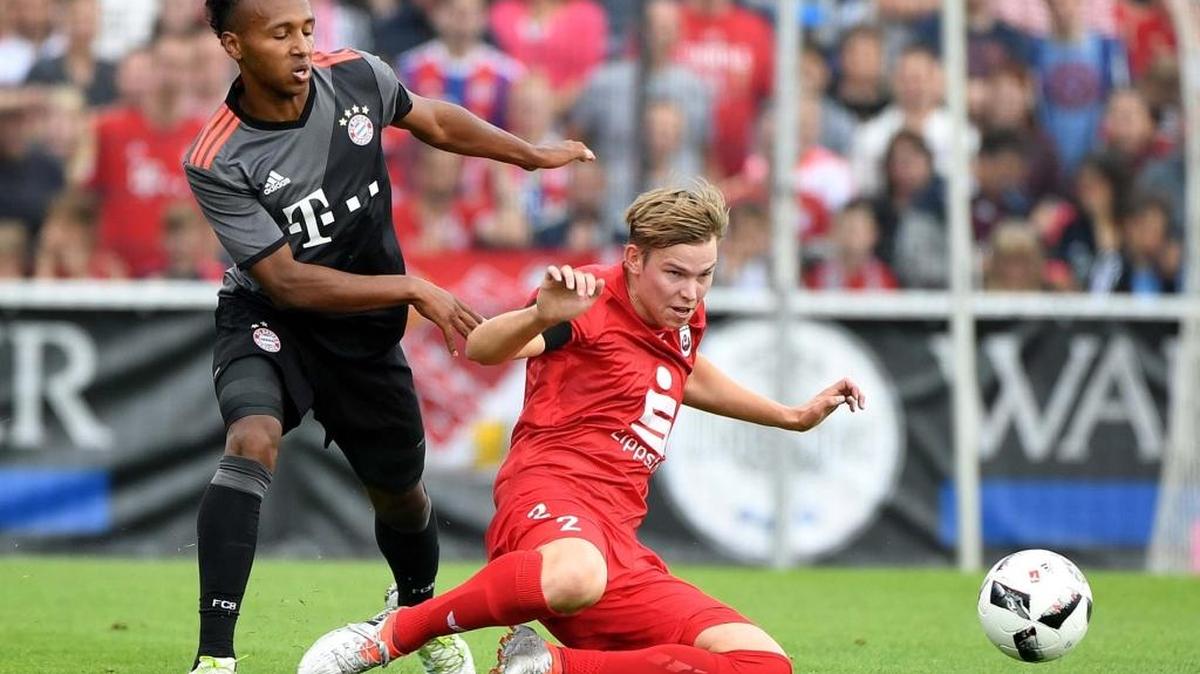 FC Bayern Munich's Julian Green, left, and SV Lippstadt´s Marvin Joswig battle for the ball during an exhibition July 16 in Germany. Green and Bayern Munich will play Inter Milan Saturday at Bank of American Stadium.
