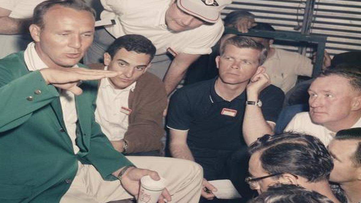 
After winning the Masters in 1962, Arnold Palmer talks to the media, including Ron Green (kneeling, center). Green covered 60 Masters’ tournaments.
