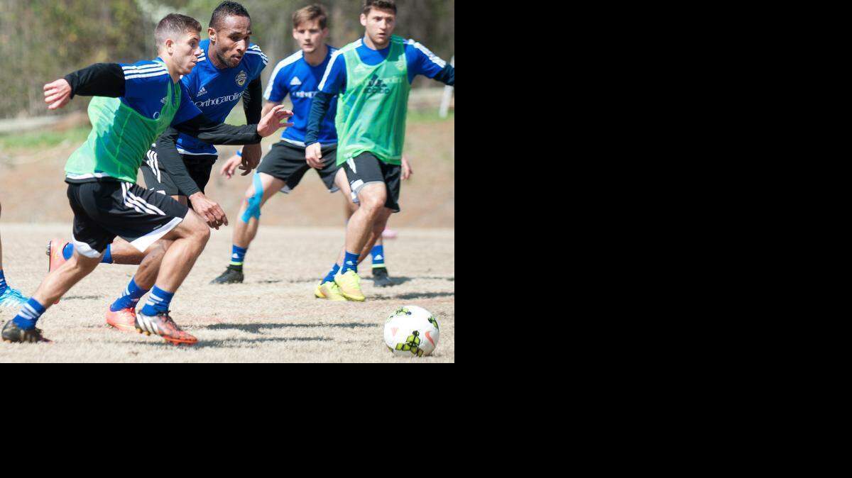
Enzo Martinez charges forward to maintain possession of the ball during a Charlotte Independence practice game.
