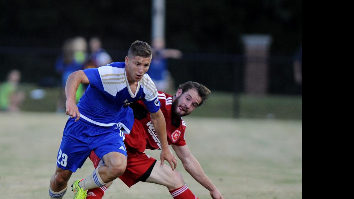 
Alex Martinez (23) of the Charlotte Independence fights for the ball against a Richmond defender during the first half Friday night’s United Soccer League game at Winthrop in Rock Hill. The game was a homecoming for Martinez and his brother and teammate Enzo. The Martinezes grew up in Rock Hill and played at Northwestern High.
