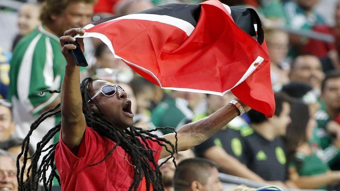 
A Trinidad and Tobago fan cheers his team as they play Cuba during the second half of a CONCACAF Gold Cup soccer match Sunday in Glendale, Ariz. Trinidad and Tobago defeated Cuba 2-0. 
