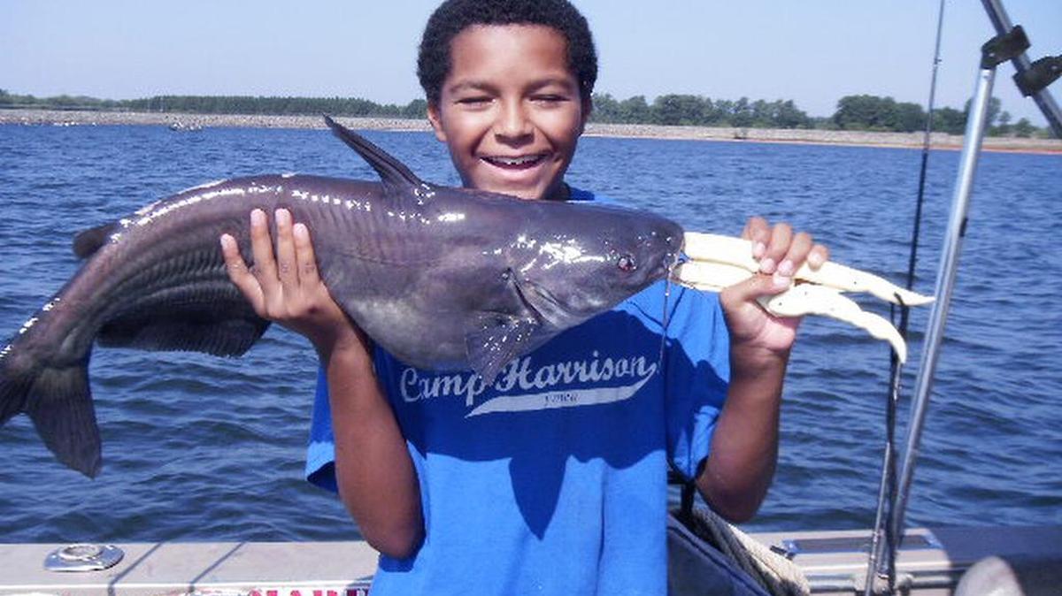 
Cody Williams, 12, of Charlotte shows off the fat blue catfish he caught recently at Lake Norman near Cowans Ford Dam while fishing with his grandfather, Bob Pettus, also of Charlotte. The two boated 22 of the catfish during a four-hour trip with guide Mac Byrum of Denver, N.C.
