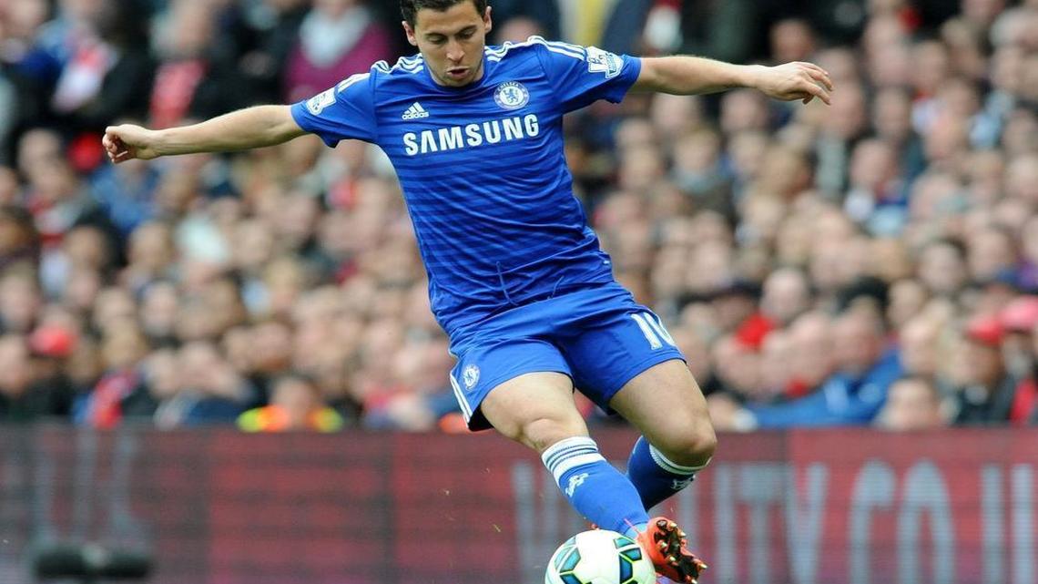 
Chelsea's Eden Hazard goes against Arsenal during the English Premier League soccer match at the Emirates Stadium in London.
