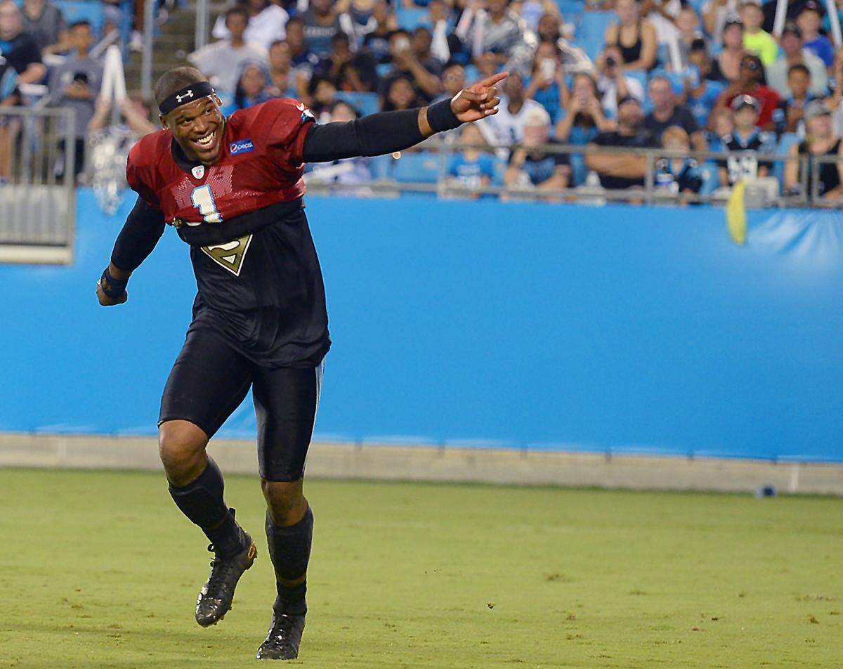 Carolina Panthers quarterback Cam Newton encourages fans to do the wave at Bank of America Stadium in 2016.