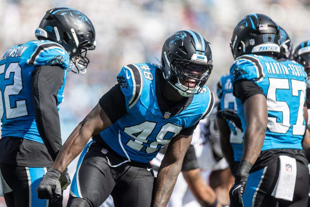 Carolina Panthers linebacker Thomas Incoom celebrates after a defensive play against the Atlanta Falcons on Sunday at Bank of America Stadium.