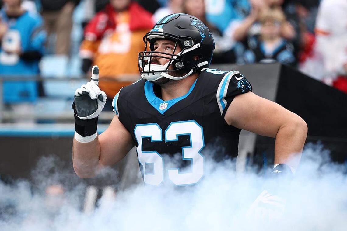 CHARLOTTE, NORTH CAROLINA - DECEMBER 21: Austin Corbett #63 of the Carolina Panthers is introduced prior to the game against the Tampa Bay Buccaneers at Bank of America Stadium on December 21, 2025 in Charlotte, North Carolina. (Photo by Jared C. Tilton/Getty Images)