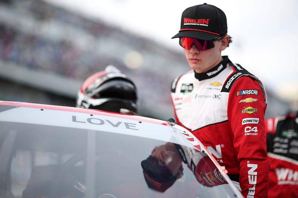 Jesse Love, driver of the #2 Whelen Chevrolet, enters his car prior to the NASCAR O'Reilly Auto Parts Series United Rentals 300 at Daytona International Speedway on February 14, 2026 in Daytona Beach, Florida.