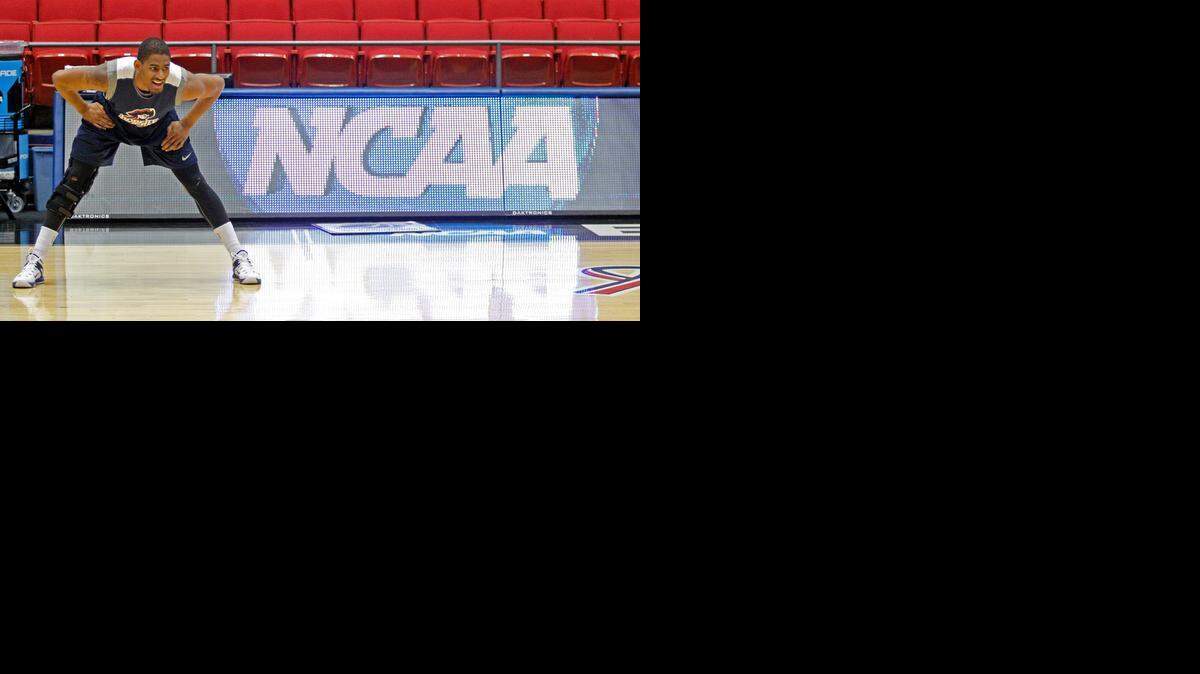
Robert Morris' Rodney Pryor stretches before practice for an NCAA first round game on Tuesday, March 17, 2015, in Dayton, Ohio. Robert Morris will play North Florida in Dayton on Wednesday. 
