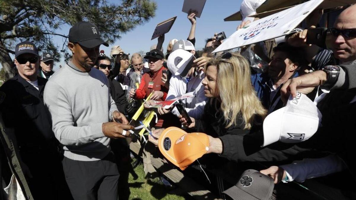 Golfer Tiger Woods, left, was left off a list of the top 50 black athletes of all time.