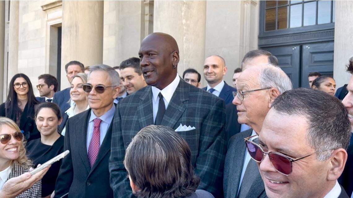 Michael Jordan, flanked by his longtime business partner Curtis Polk (left) and NASCAR CEO Jim France (right) discuss the conclusion via settlement of the monumental antitrust trial that pitted two Cup Series teams against the sanctioning body of NASCAR on Thursday, Dec. 11, 2025, on the steps of the U.S. District Court of the Western District of North Carolina in Charlotte.