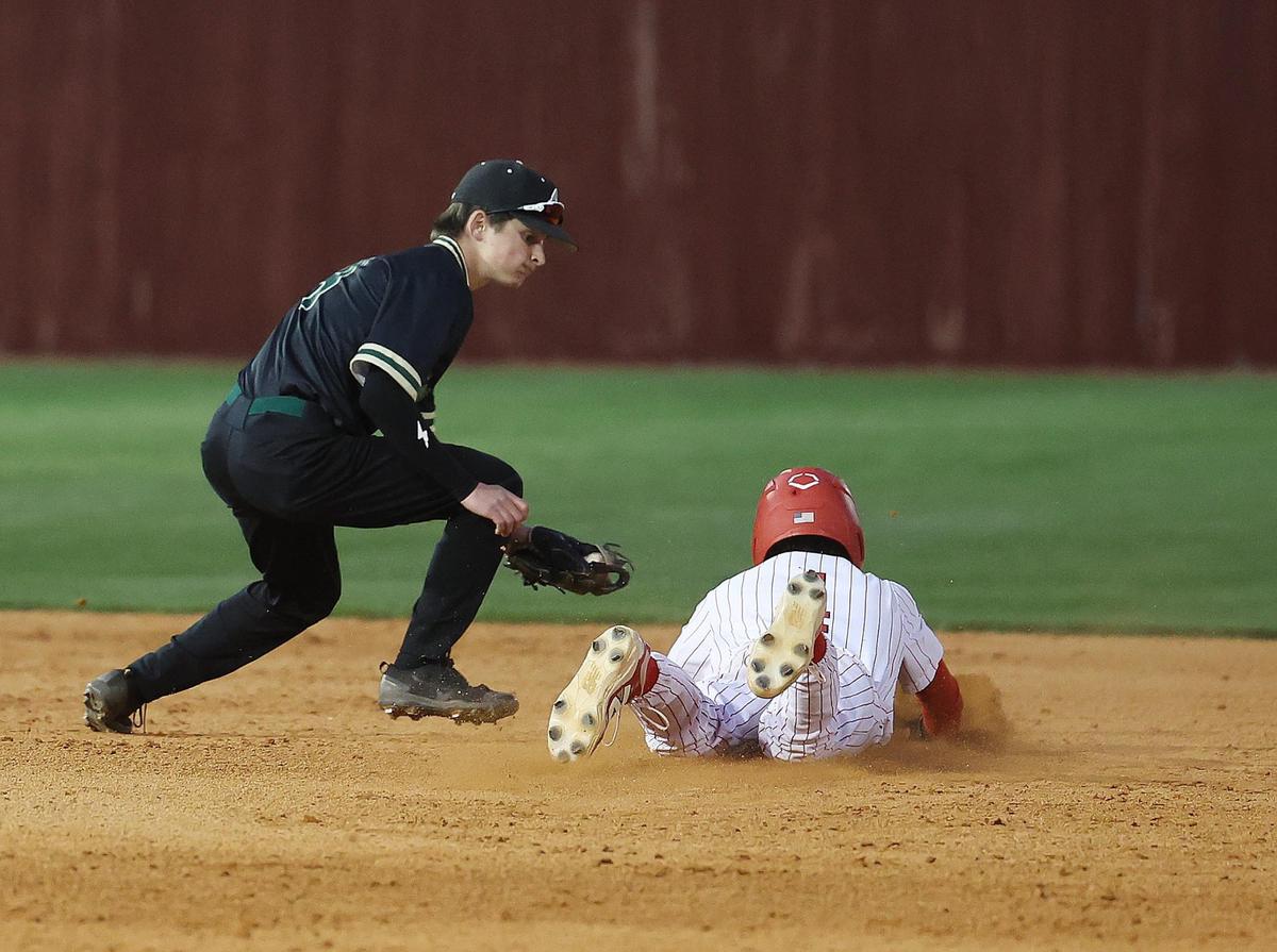 Catawba Ridge’s Jack Shelnutt tries to tag South Meck’s Avery Rocco Wednesday in Charlotte.