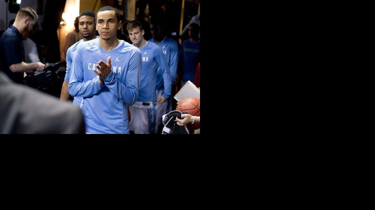 
North Carolina’s Marcus Paige (5) and his teammates wait to enter the court for their game against Boston College on Wednesday, March 11, 2015 during the second round of the Atlantic Coast Conference Basketball Tournament at the Greensboro Coliseum in Greensboro.
