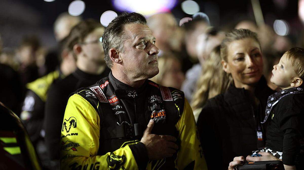 DAYTONA BEACH, FLORIDA - FEBRUARY 13: Tony Stewart, driver of the #25 Ram RAM, stands during the national anthem prior to the NASCAR Craftsman Truck Series Fresh from Florida 250 at Daytona International Speedway on February 13, 2026 in Daytona Beach, Florida. (Photo by James Gilbert/Getty Images)