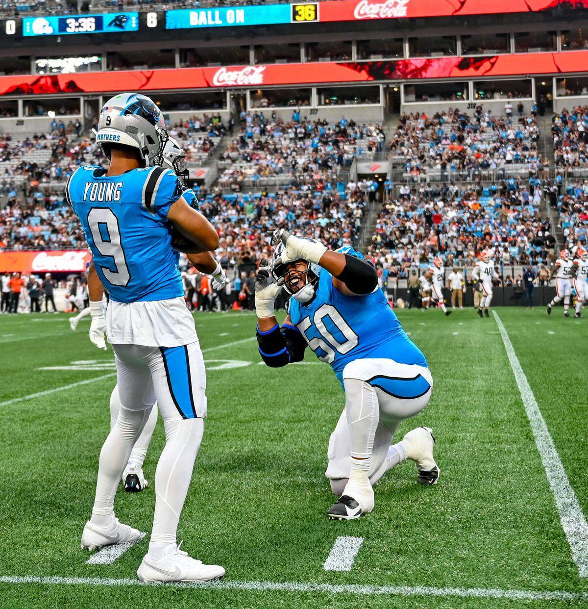 The Carolina Panthers QB Bryce Young and offensive guard Robert Hunt celebrate a touchdown during their first preseason game against The Cleveland Browns at The Bank of America Stadium in Charlotte, NC, Friday, August 8, 2025. 