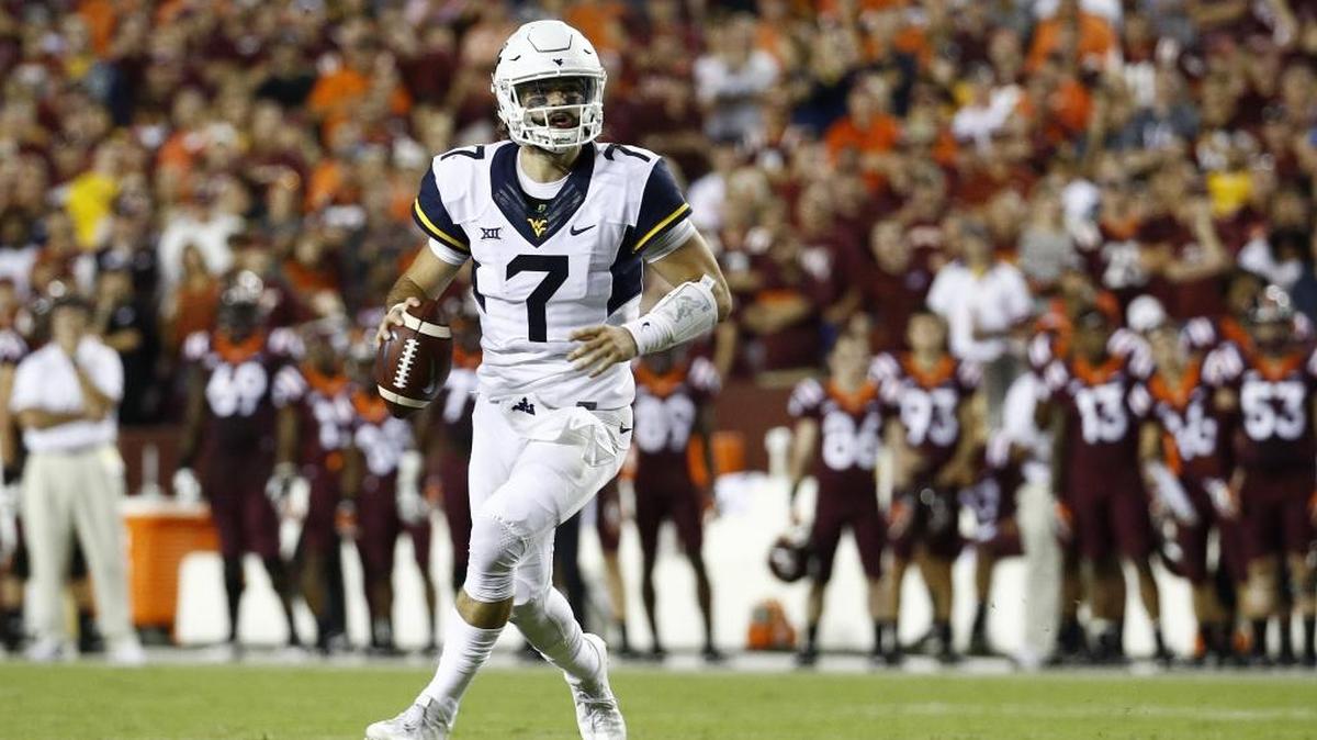 West Virginia quarterback Will Grier, who played at Davidson Day high school in Mecklenburg County, played his first college game in nearly two years against Virginia Tech in Landover, Md., Sunday, Sept. 3, 2017. (AP Photo/Patrick Semansky)
