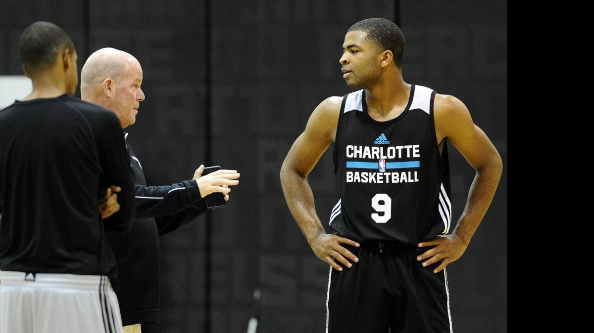 
Aaron Harrison talks with Charlotte Hornets' head coach Steve Clifford after Wednesday’s practice at the Novant Health Training Center inside Time Warner Cable Arena.
