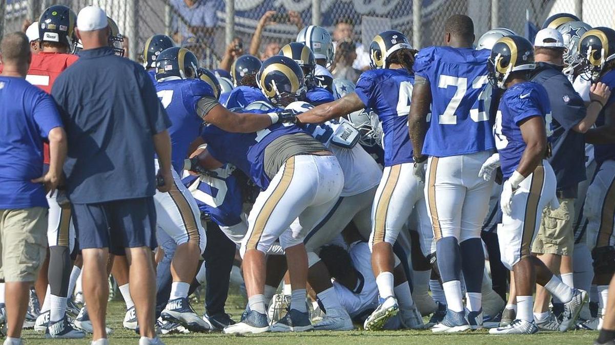 
Players clear the benches during two on-field fights during the joint Cowboys and Rams practice Tuesday.
