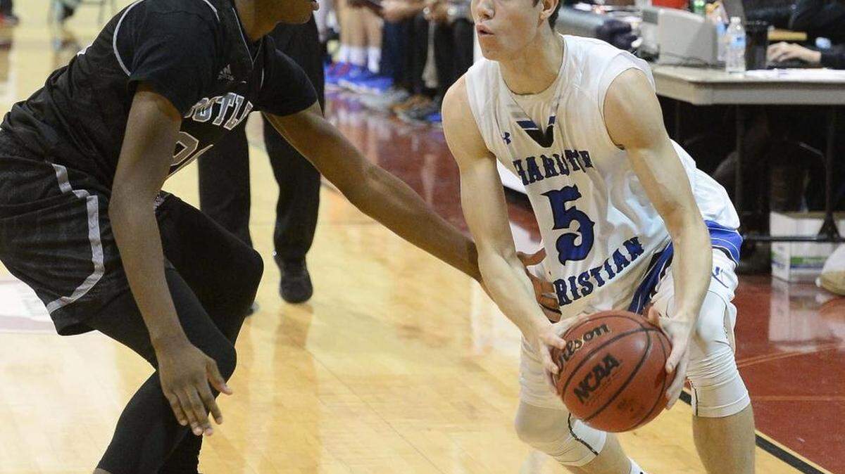 Charlotte Christian's Rob Peterson, right, drives against Butler's Zane Rankin during the Hoodies House of Hope Tournament last month at Providence Day.