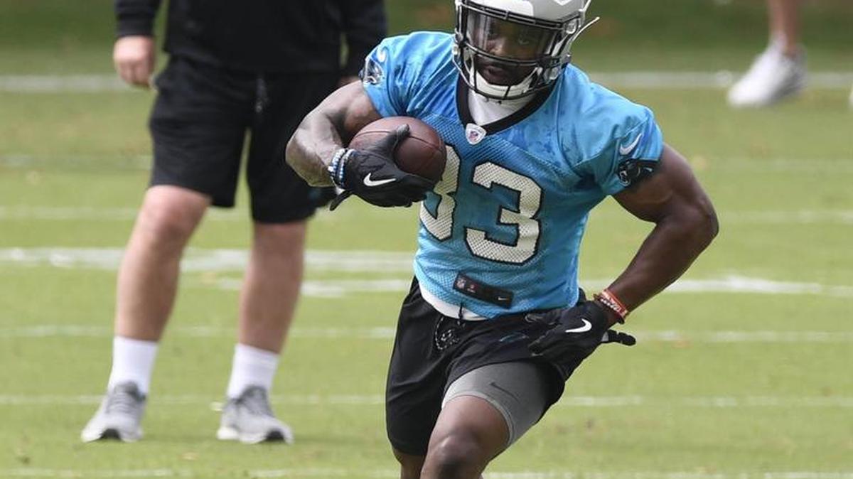 Under offensive coordinator Norv Turner’s watchful eye, Carolina Panthers running back Elijah Holyfield heads upfield during the second session of rookie minicamp Friday at the team’s practice field. The Panthers liked the Georgia product throughout the predraft process and signed him after he went undrafted last month.
