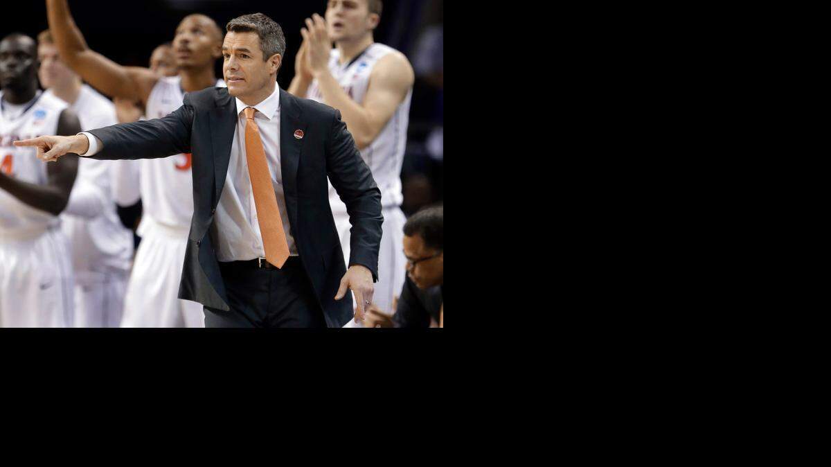 
Virginia head coach Tony Bennett directs his team against Belmont during the second half of an NCAA tournament game Friday in Charlotte.
