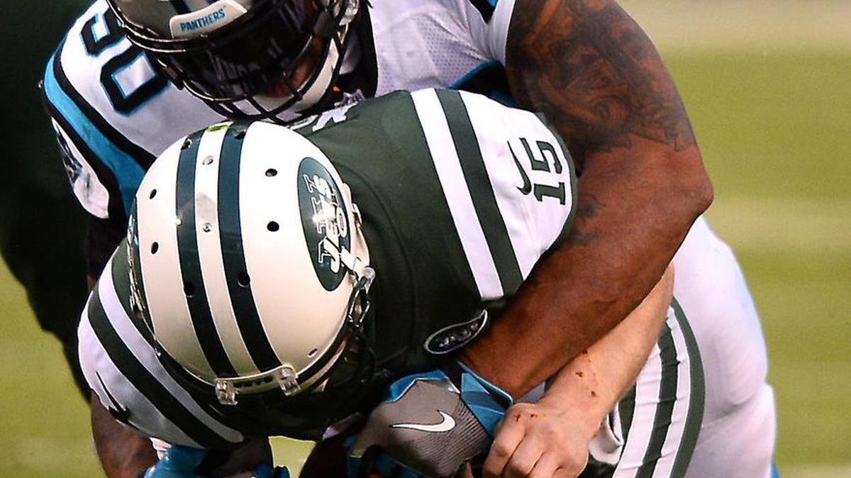 New York Jets quarterback Josh McCown (15) is sacked by the Carolina Panthers’ Julius Peppers in 2017. The Jets and Panther were two of the teams McCown played for during a 17-year career in the NFL.