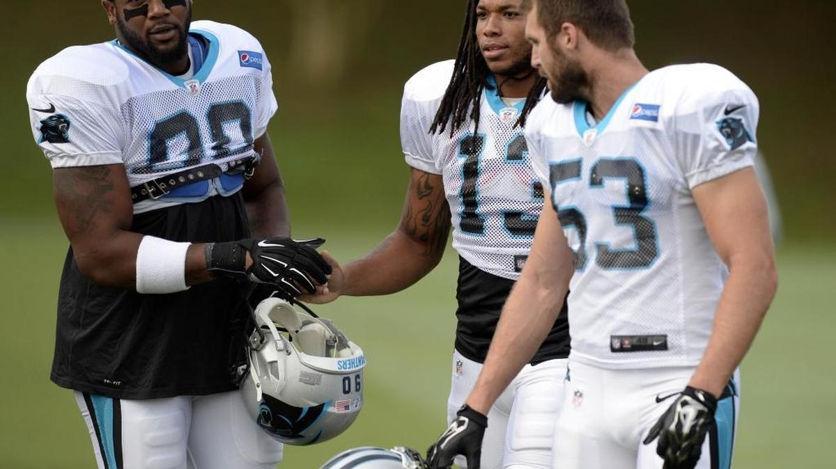 
Panthers' Frank Alexander (left) greets Kelvin Benjamin (center) and Ben Jacobs before Wednesday’s scrimmage against Miami. An hour into the scrimmage, Benjamin injured his knee and will miss the remainder of the season. 
