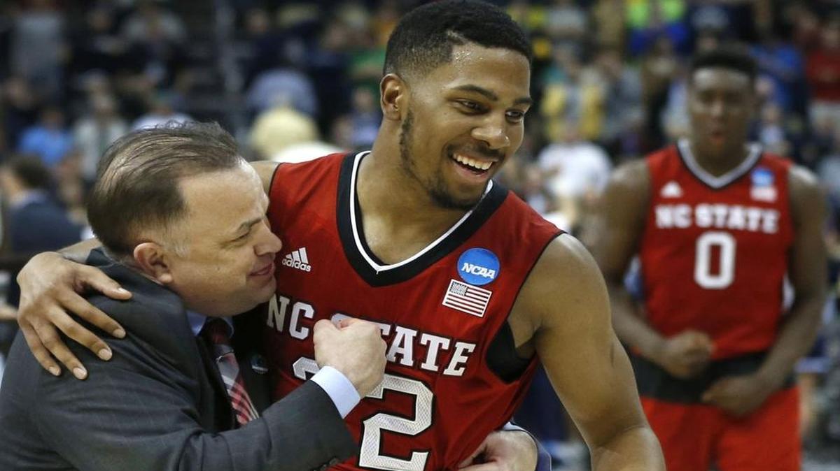 
N.C. State assistant coach Rob Moxley celebrates with Ralston Turner (22) after the Wolfpack’s 71-68 victory over Villanova in the third round NCAA Division I Men’s Basketball Tournament at the Consol Energy Center in Pittsburgh, Pa. Saturday, March 21, 2015.
