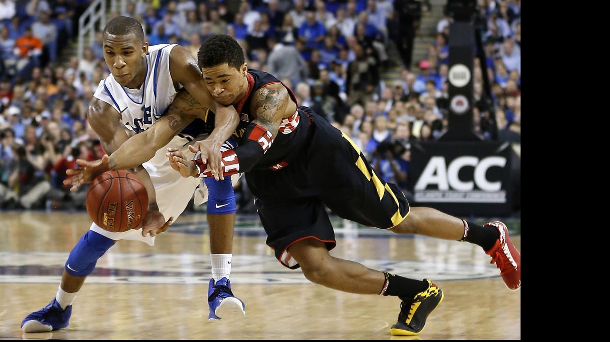 
2013 file – Duke's Rasheed Sulaimon (14) and Maryland's Nick Faust (5) go after the lose ball during the second half of Maryland's 83-74 victory over Duke in the quarterfinals of the ACC Men's Basketball Tournament at the Greensboro Coliseum. Sulaimon has decided to transfer to Maryland.
