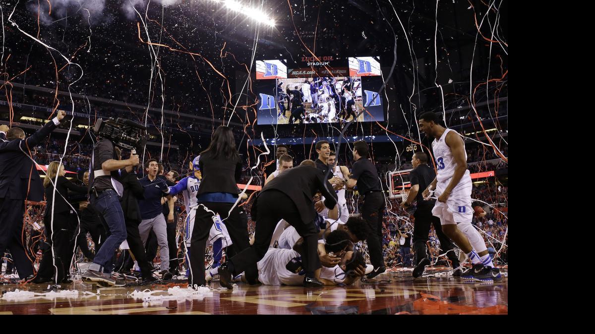 
Duke players celebrate their 68-63 victory over Wisconsin in the NCAA Final Four college basketball tournament championship game April 6, 2015, in Indianapolis. 
