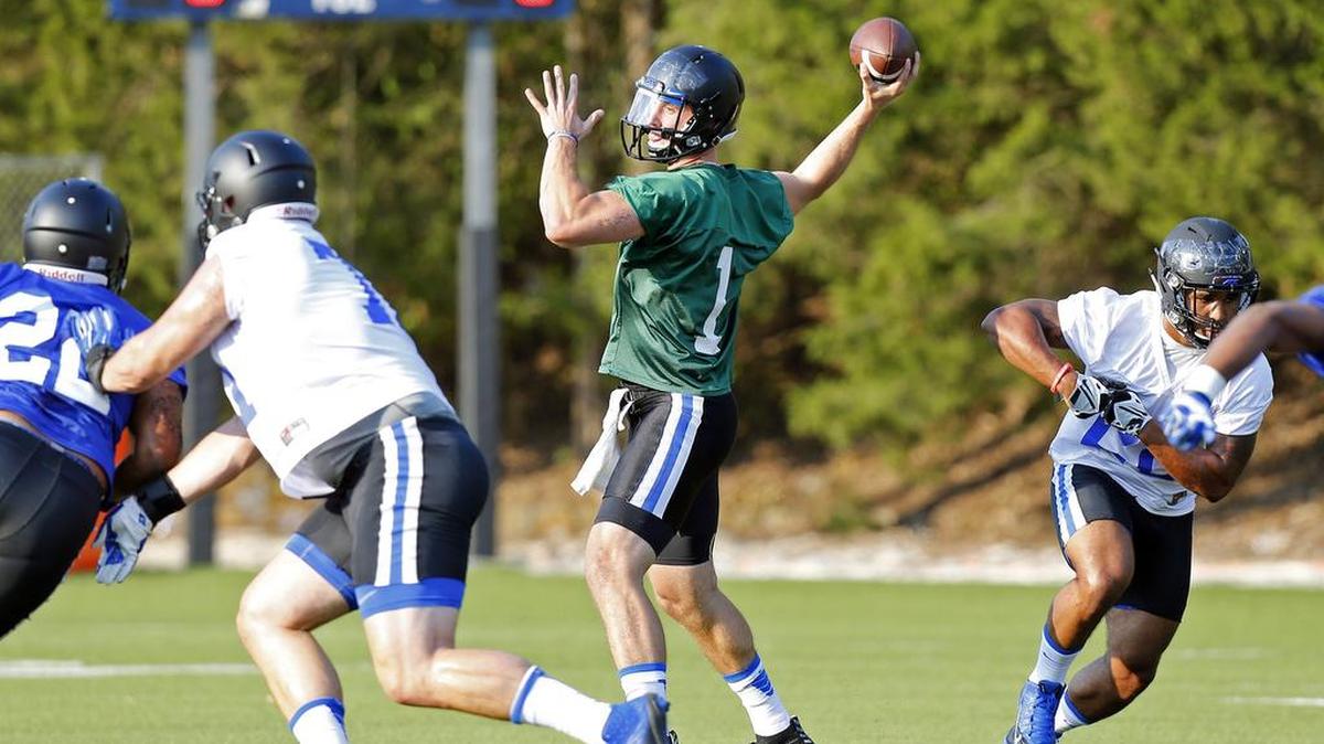 
QB Thomas Sirk (1) looks to pass as Duke holds its first football practice of the season Aug. 5. 
