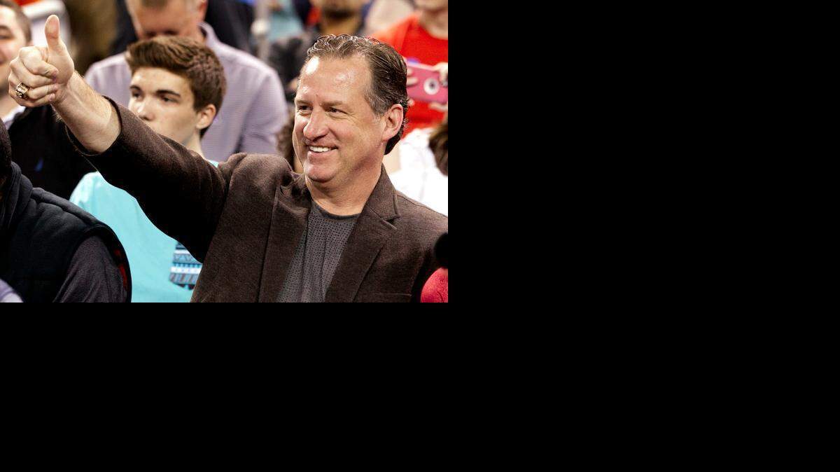 
N.C. State head coach Mark Gottfried waves to fans during the 2015 College All-Star game at Lucas Oil Stadium on Friday in Indianapolis.
