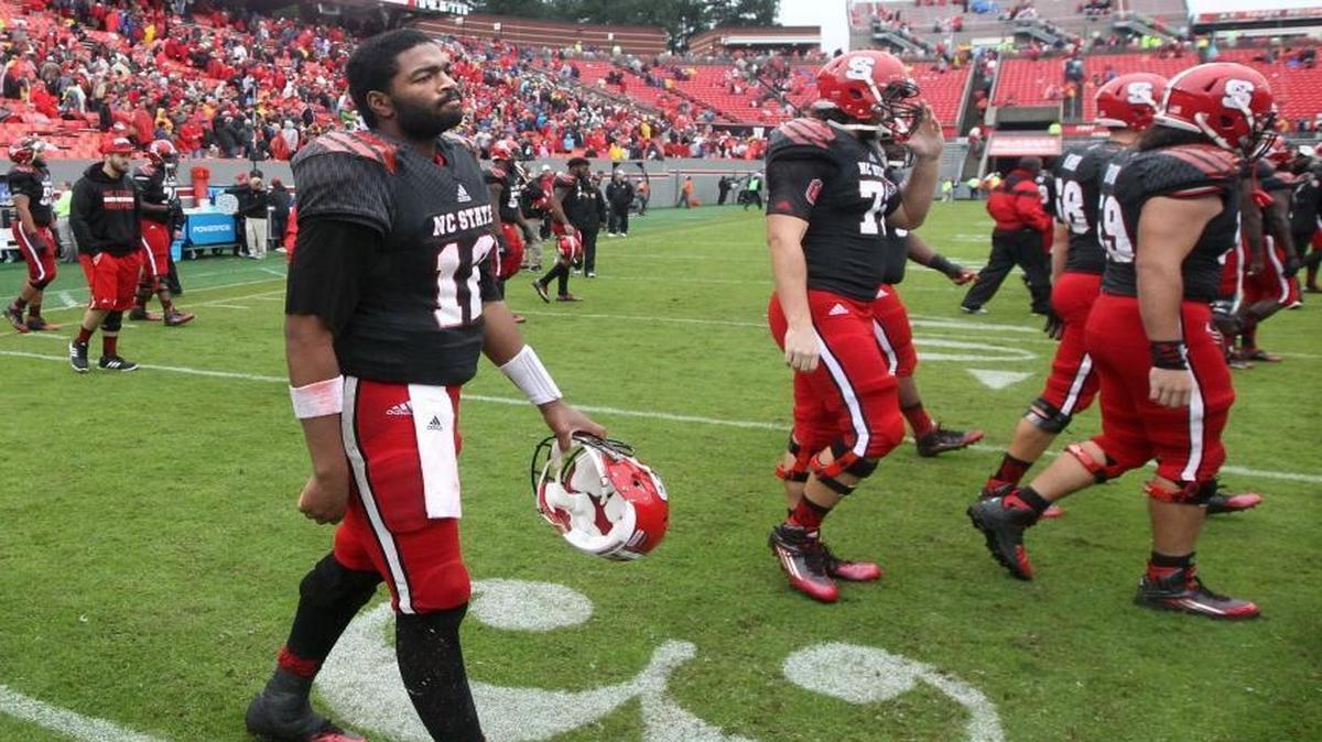 
N.C. State quarterback Jacoby Brissett (12) heads off the field after Louisville’s 20-13 victory over the Wolfpack at Carter-Finley Stadium in Raleigh,.
