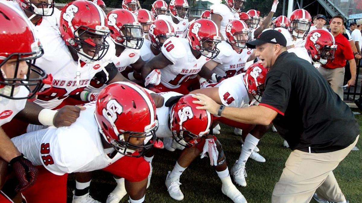 
N.C. State head coach Dave Doeren gets ready to lead his team onto the field before the Wolfpack's game against Old Dominion at S.B. Ballard Stadium in Norfolk, Va., Saturday Sept. 19, 2015.
