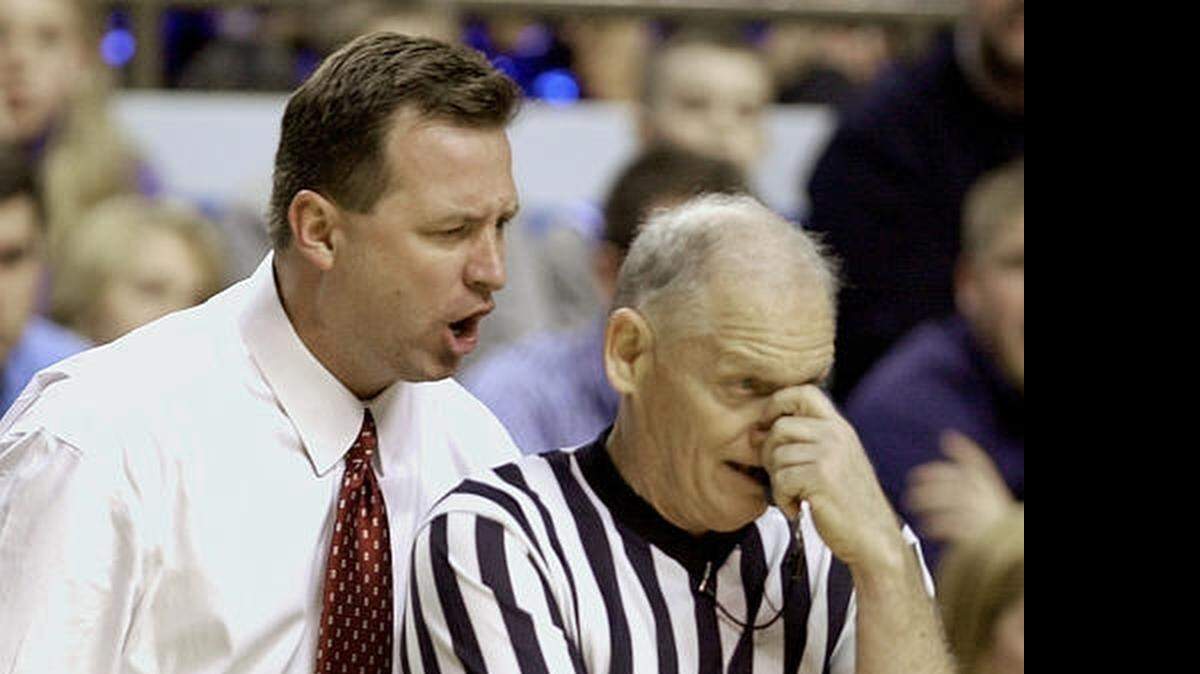 
Then-Alabama coach Mark Gottfried gives official John Clougherty an earful during the second half of a game against Kentucky in  2002.
