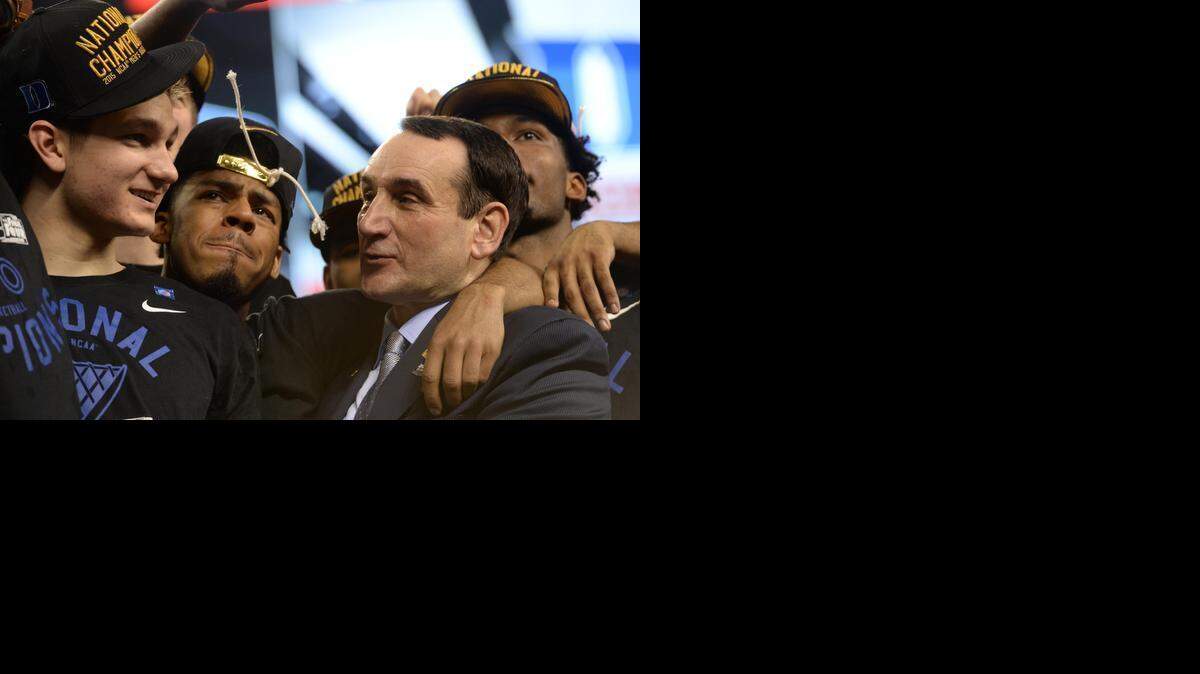 
Duke head coach Mike Krzyzewski, right, talks with Grayson Allen (3), left, after Duke's 68-63 victory over Wisconsin in the 2015 Division I Men's Basketball Championship game at Lucas Oil Stadium in Indianapolis, Ind., Monday, April 6, 2015.
