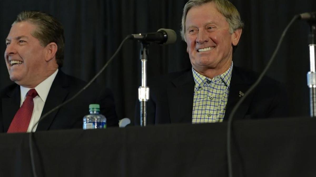 
South Carolina football coach Steve Spurrier (right) and athletics director Ray Tanner share a laugh during Tuesday’s news conference in Columbia, where Spurrier announced his resignation.
