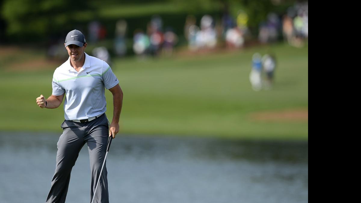 Rory McIlroy pumps his fist after making birdie on the 16th green during third round action in the Wells Fargo Championship at Quail Hollow Club Saturday.